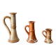 trio of 70s sandstone candlesticks