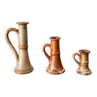 trio of 70s sandstone candlesticks