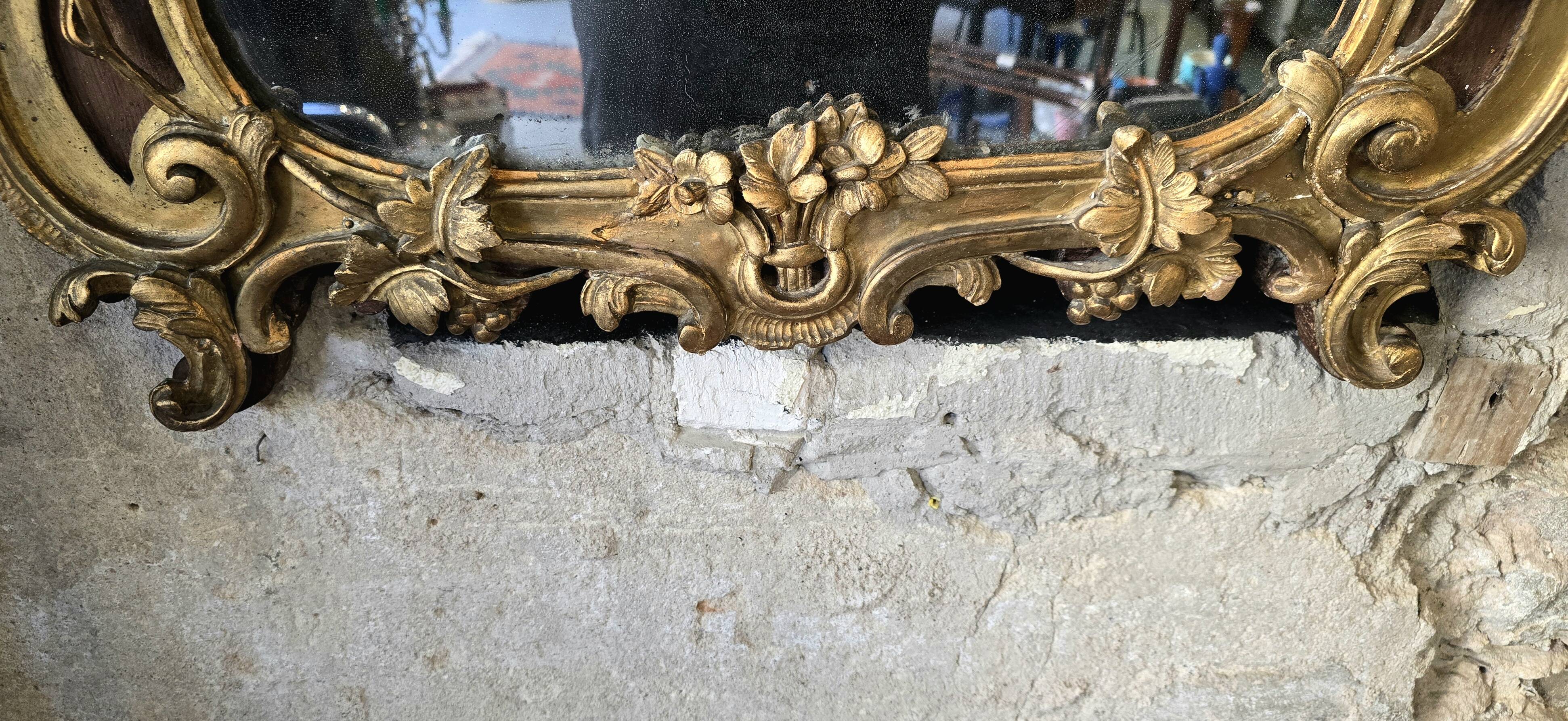 Louis XV period mirror in gilded wood and stucco, 18th century
