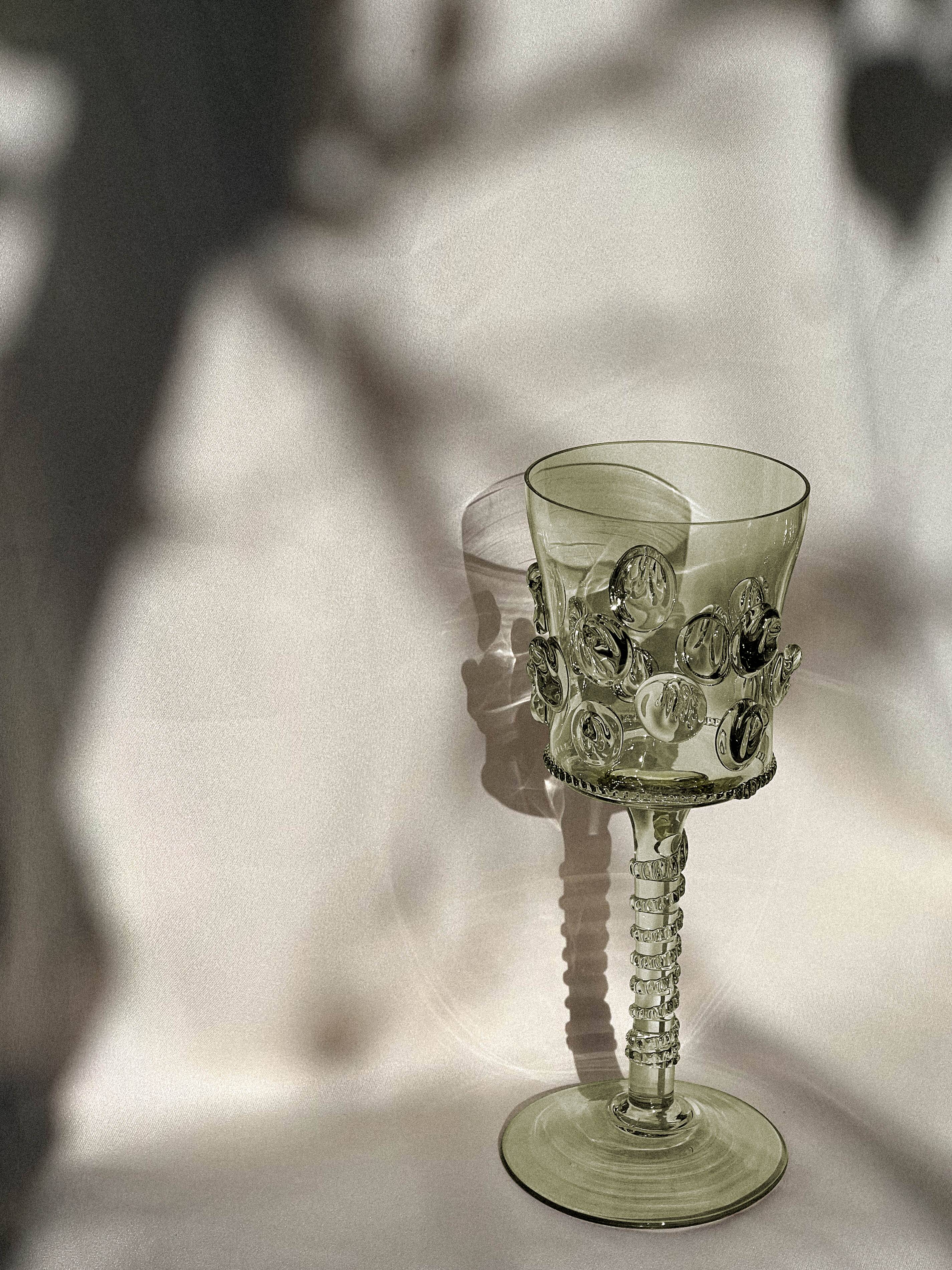 pair of blown wine glasses - green