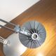 Grey LED architect lamp with spring arm and swivel base.