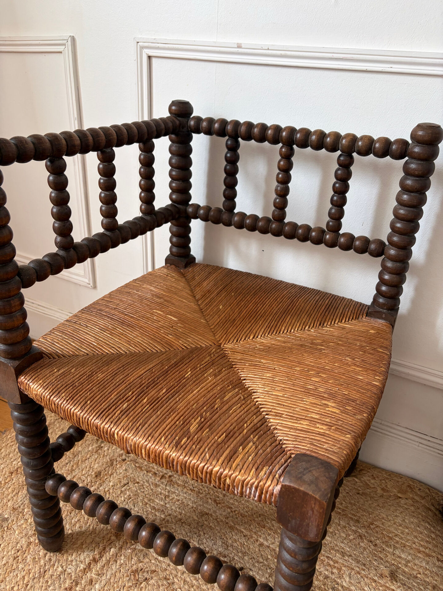 Pair of rush-seated chairs by the fireside "bobbin"