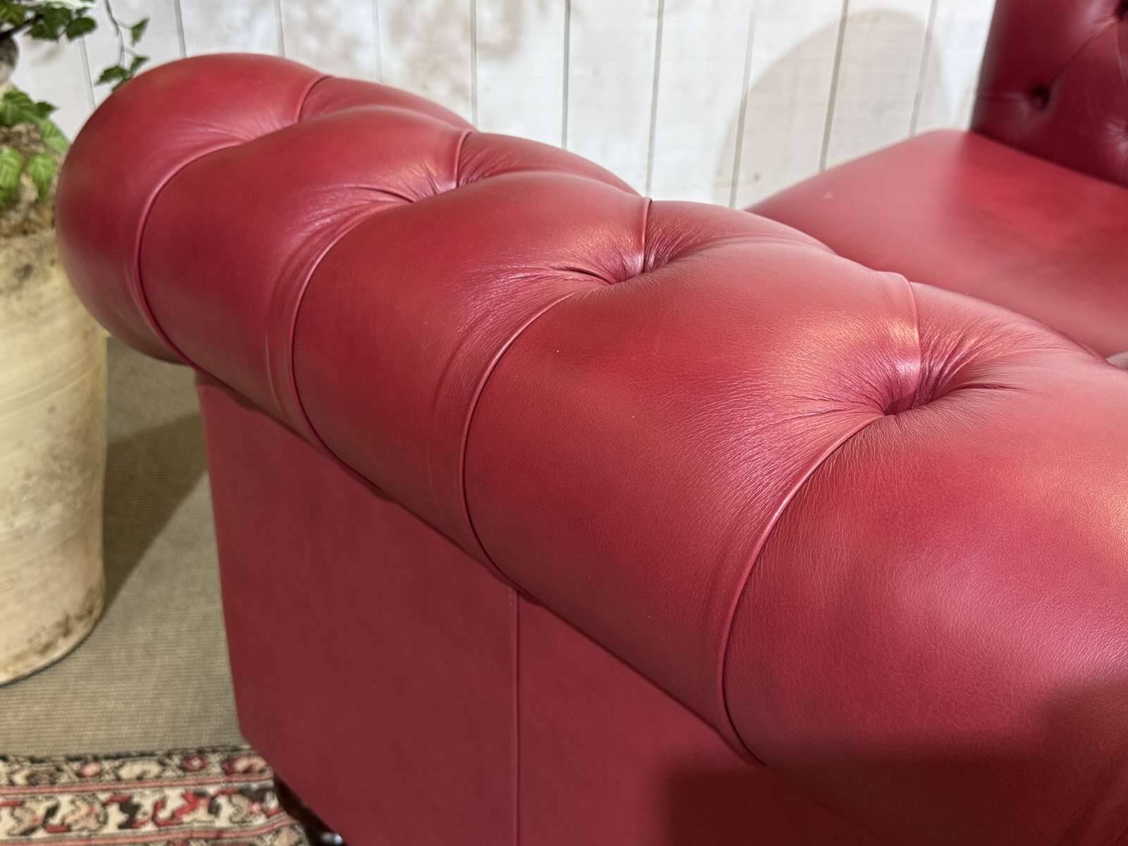Chesterfield 2-seater leather sofa, modern production from the 2000s.