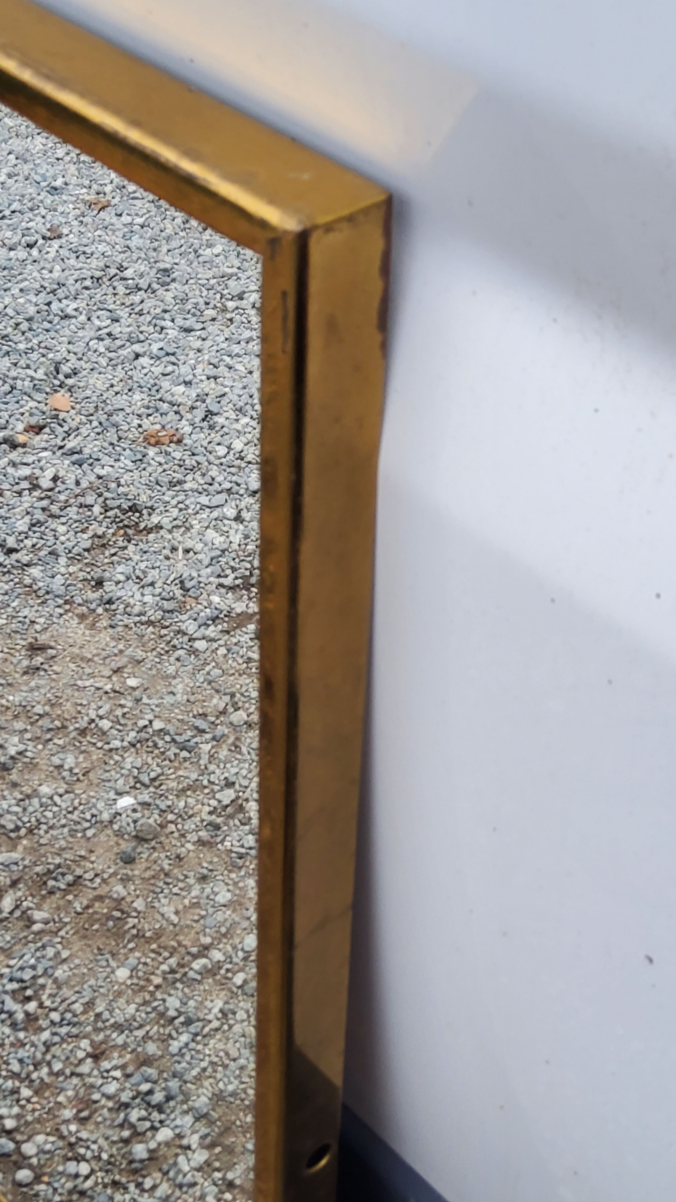 Mirror of the 70s in gilded metal, 60x35 cm