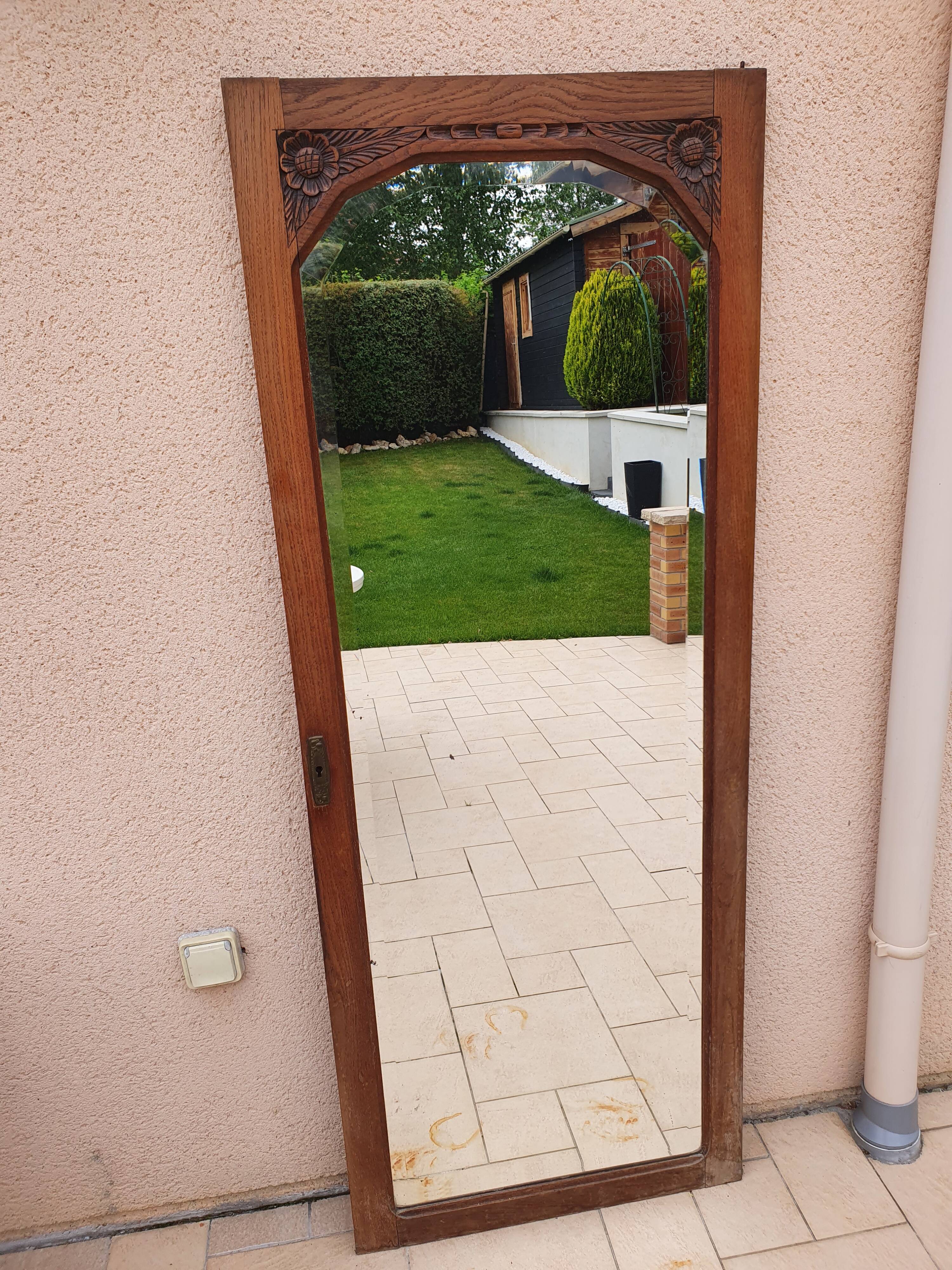 Beveled mirror on door