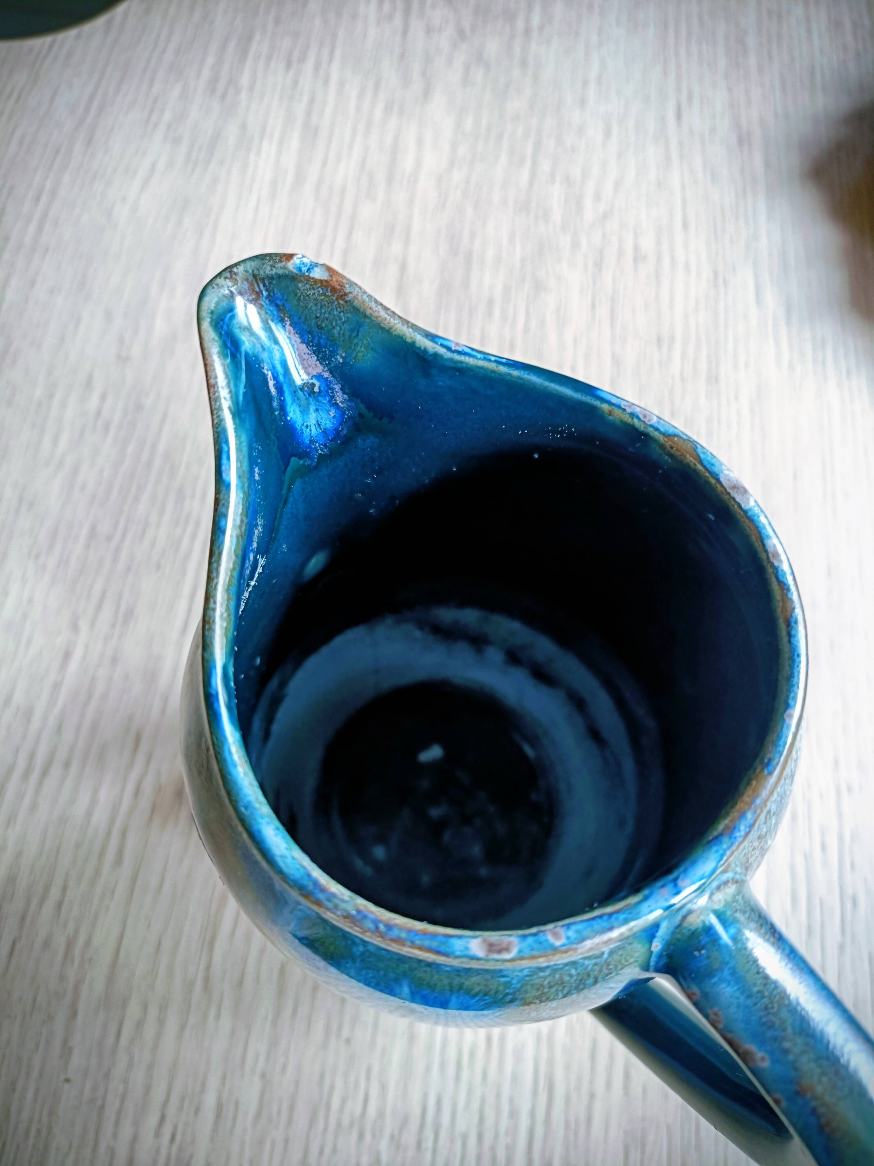 Flamed stoneware pitcher signed Denbac