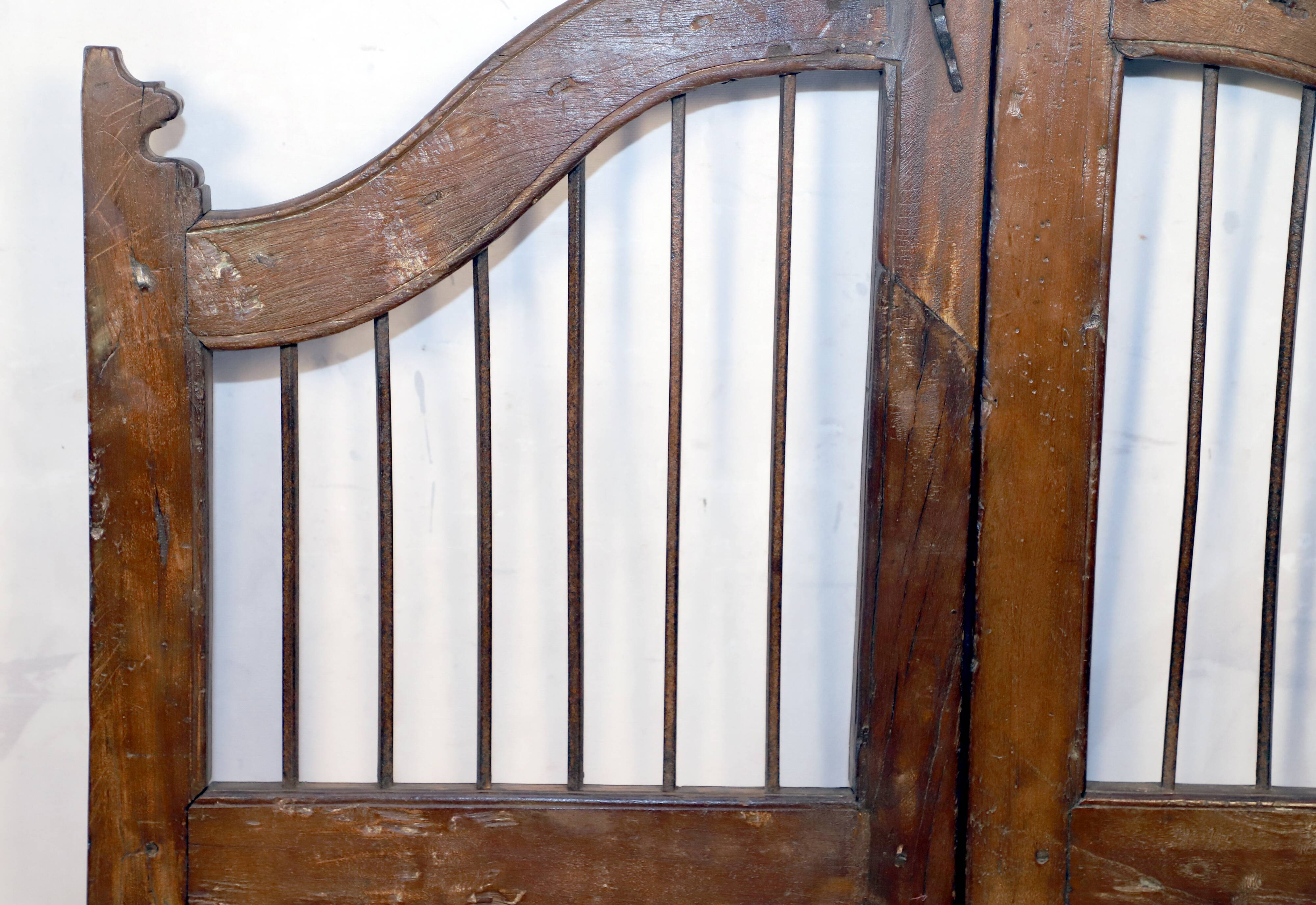 Old Burmese teak gate with openwork wrought iron panels