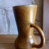 Vintage pitcher with enamelled earth cove