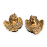 Pair of angel head wall sconces in gilded composition