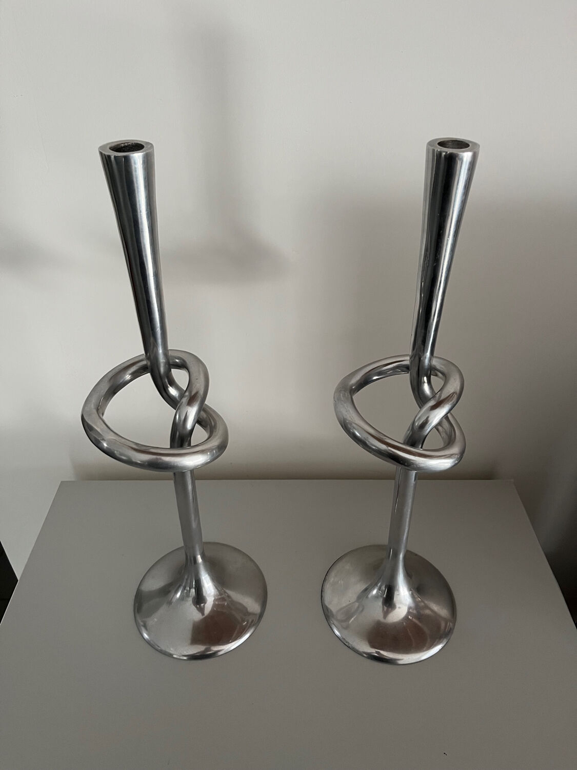 Pair of large kare design cast aluminum candlesticks