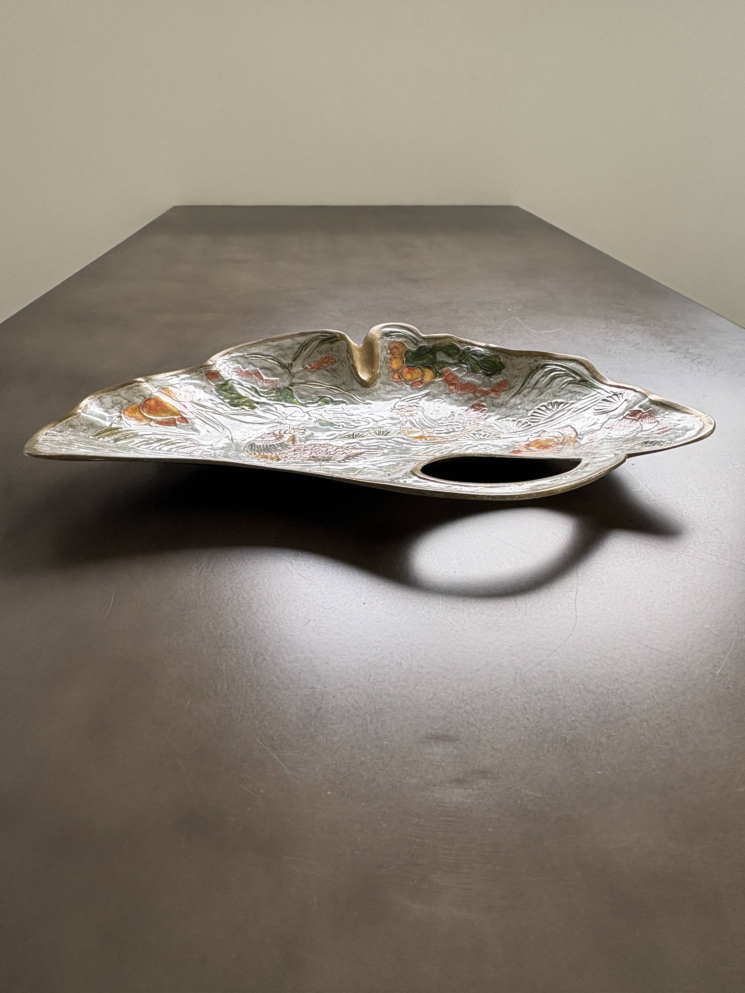 Old brass pocket emptier