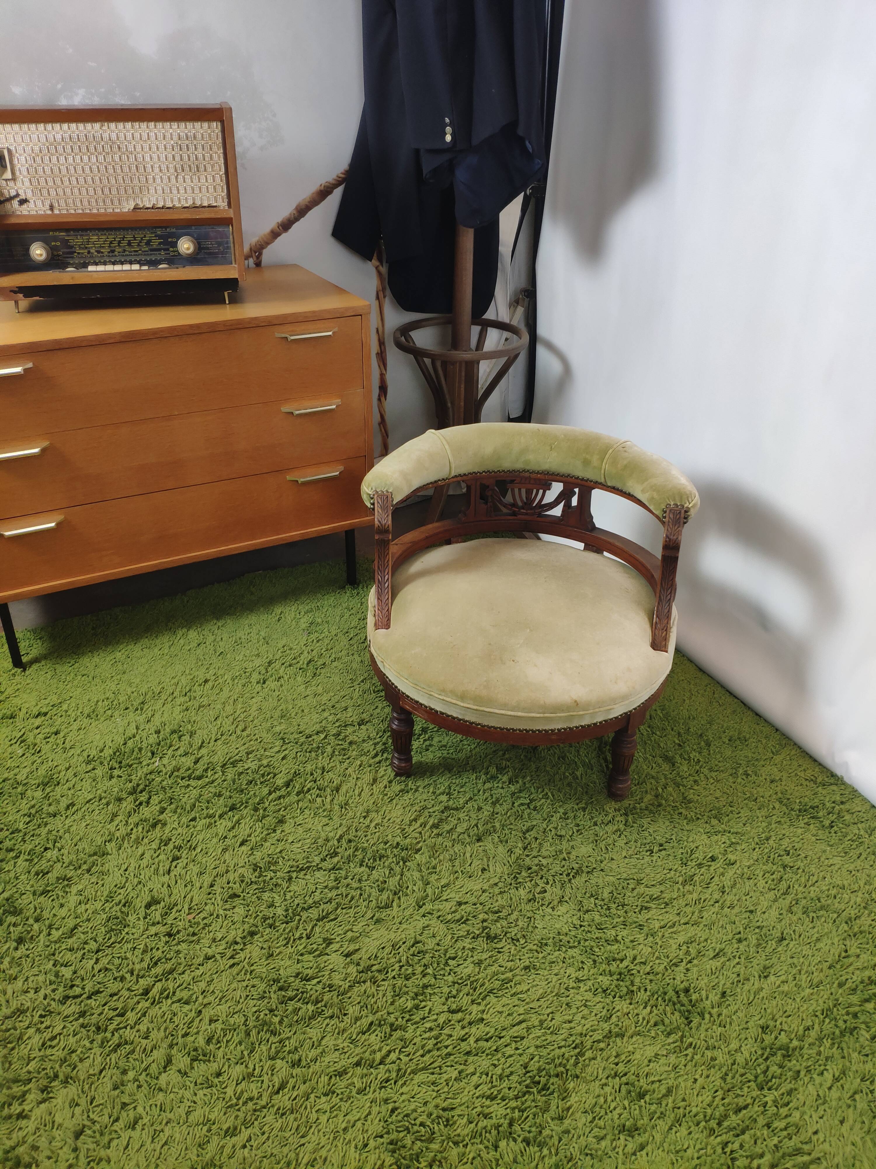 Old green velvet empire chair