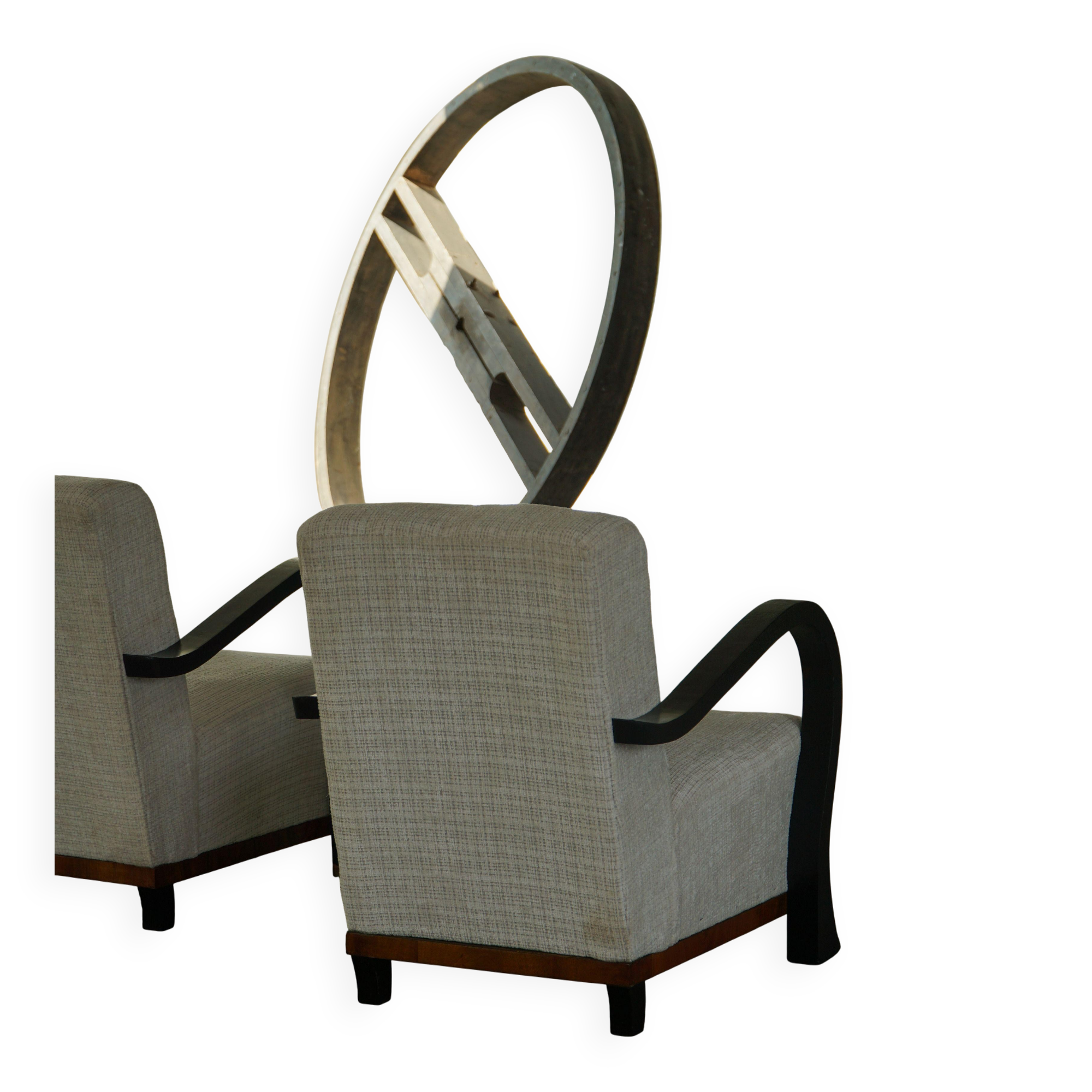 A pair of Swedish Art Deco lounge chairs with curved armrests, 1930s.