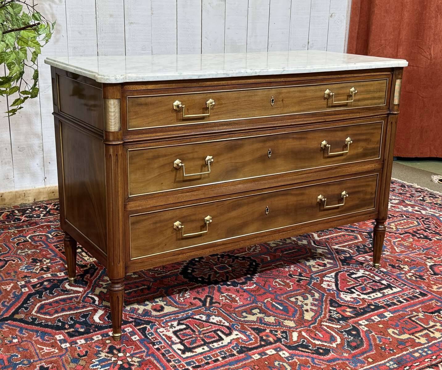Louis XVI commode in mahogany with a marble top from the 1950s.