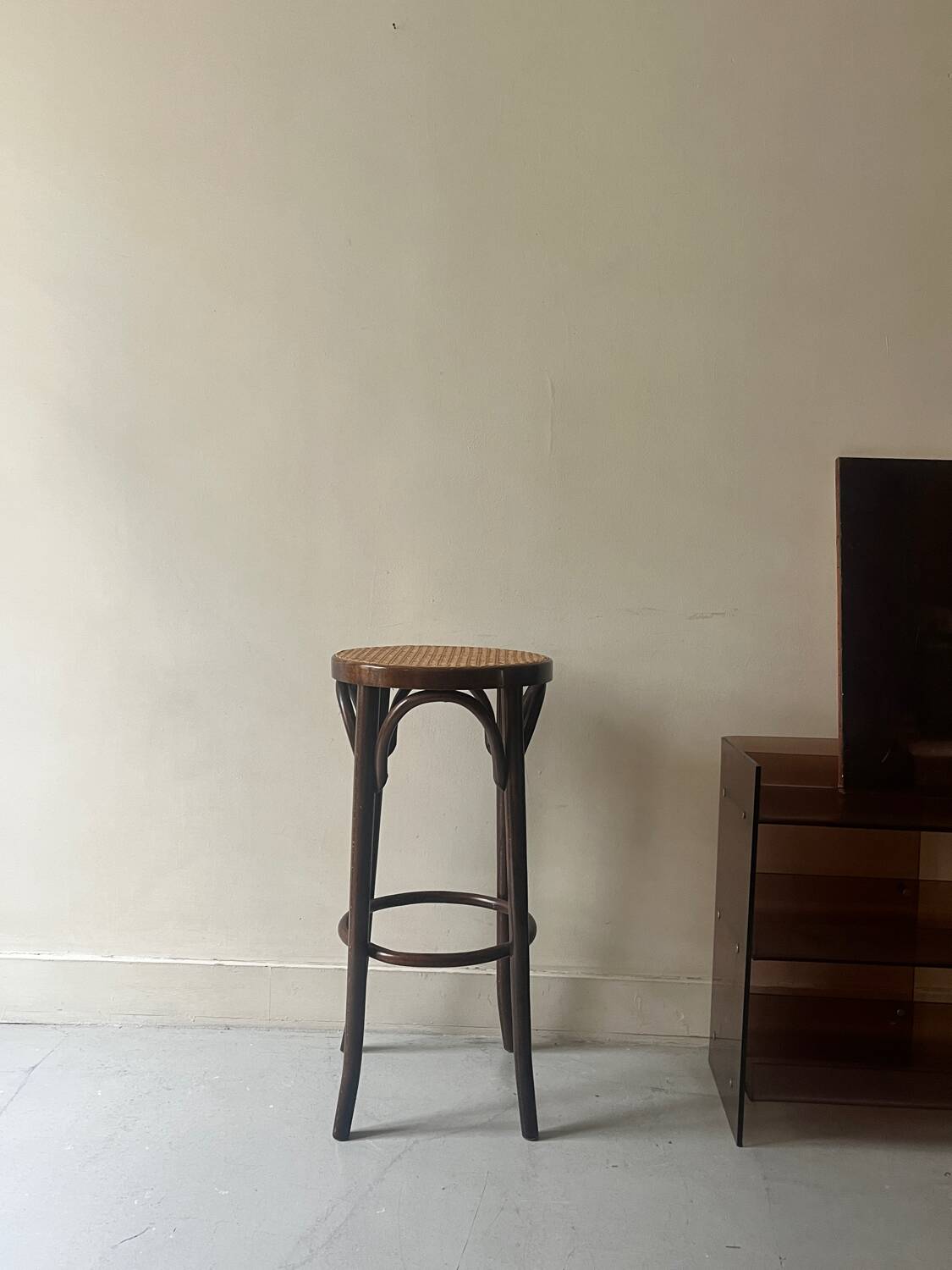 High bistro stool in turned wood and new cane, 1950