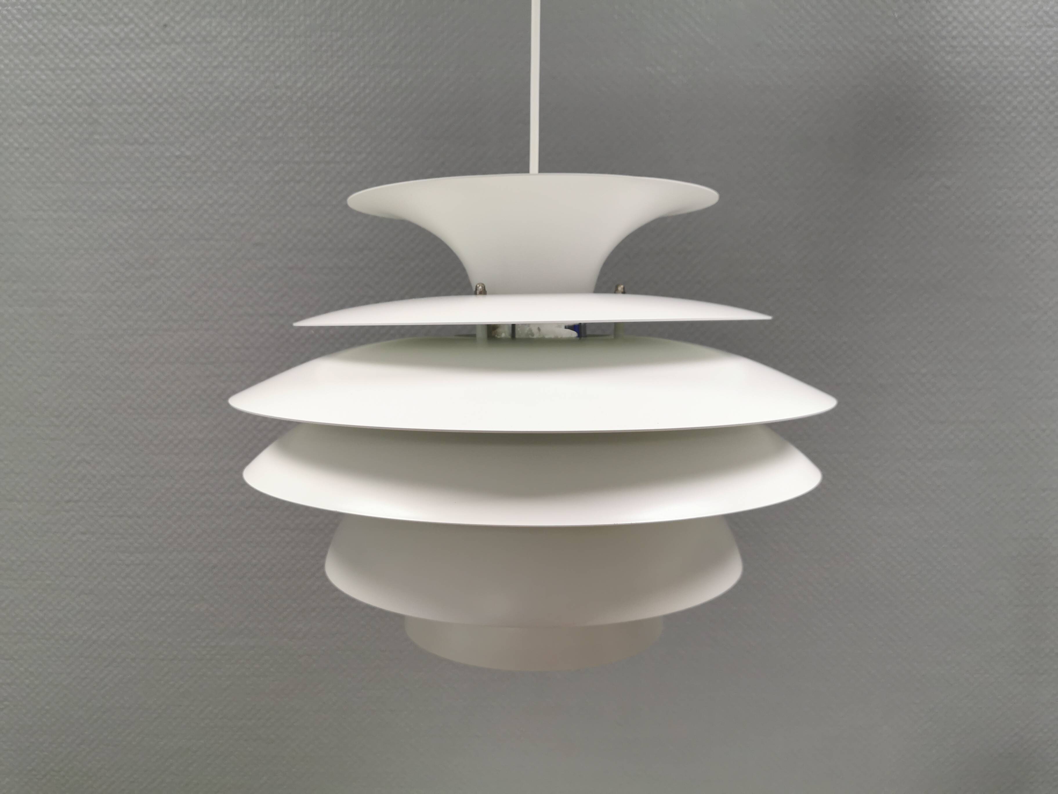 Hanging lamp with multiple layers of shades, by Junge/Vitrika