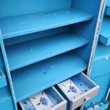 Old industrial metal cabinet in white and blue.