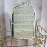 Dressing table in gold metal