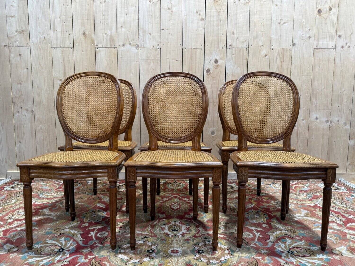 Set of 6 Louis XVI medallion chairs with caning.