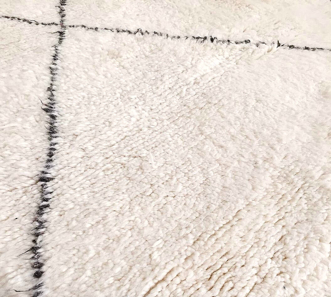 Moroccan Berber carpet handwoven wool + leather ottoman OFFERED