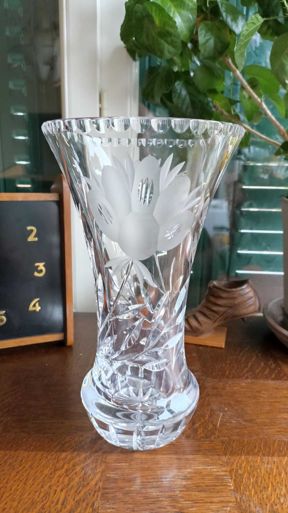 Carved solid crystal vase, floral decoration