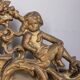EARLY 20TH CENTURY GOLDEN WOODEN WALL MIRROR DECORATED IN BAROQUE STYLE