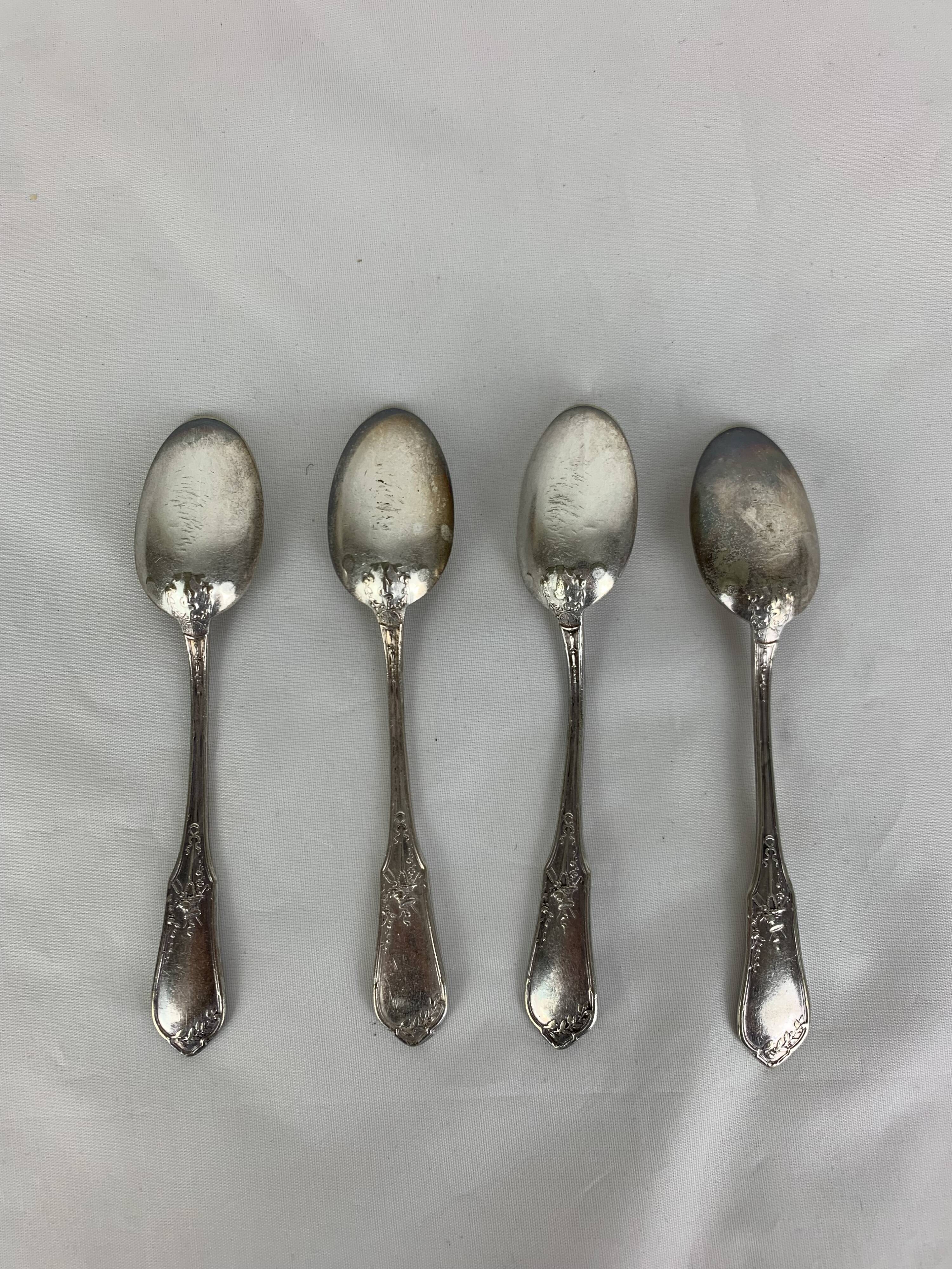 4 small silver metal spoons