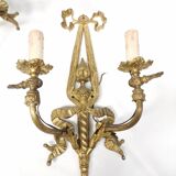 Pair of antique bronze wall lights. Louis style candlestick lamps.