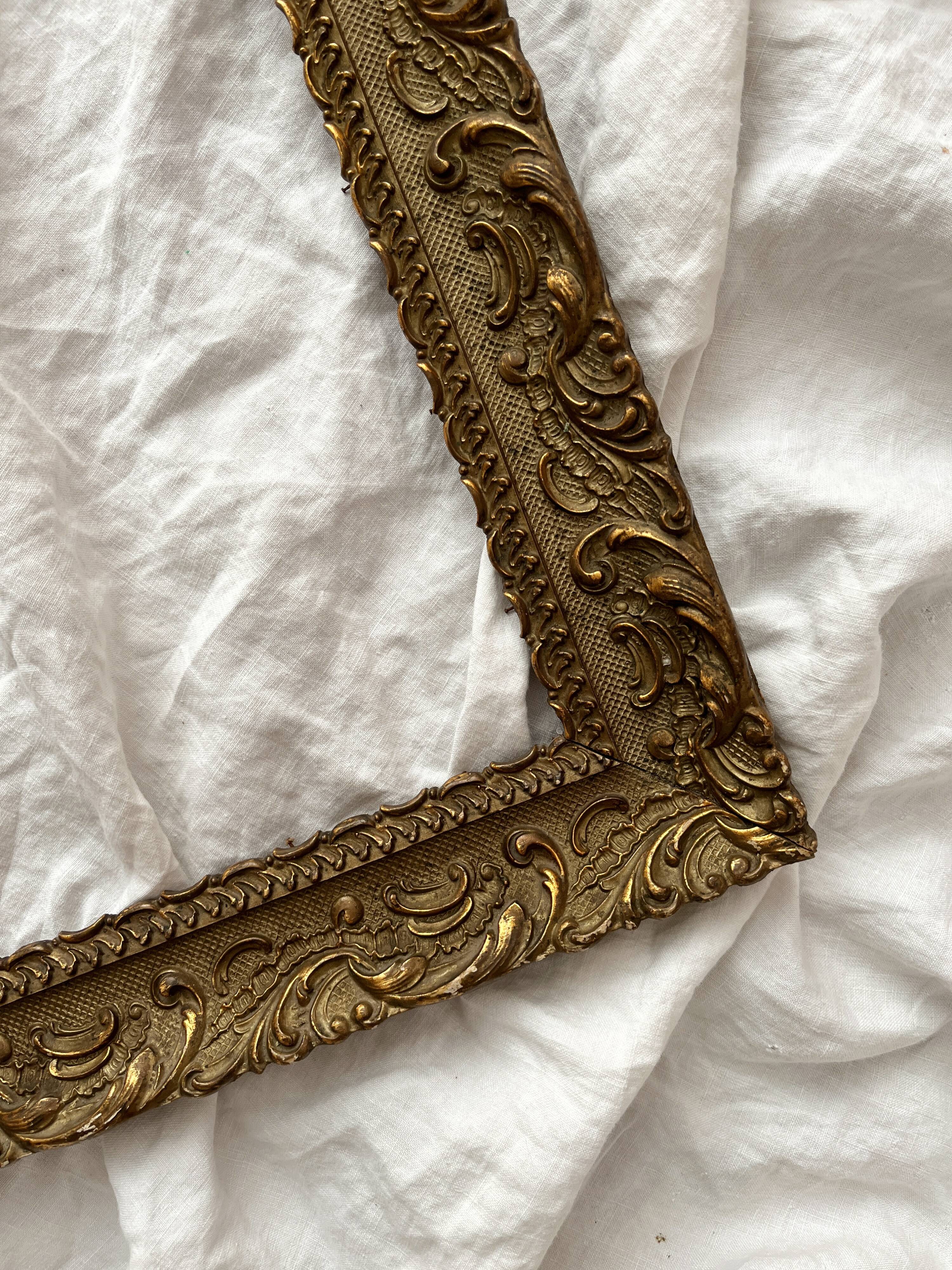 Old frame in gilded wood with stucco decoration circa 1900