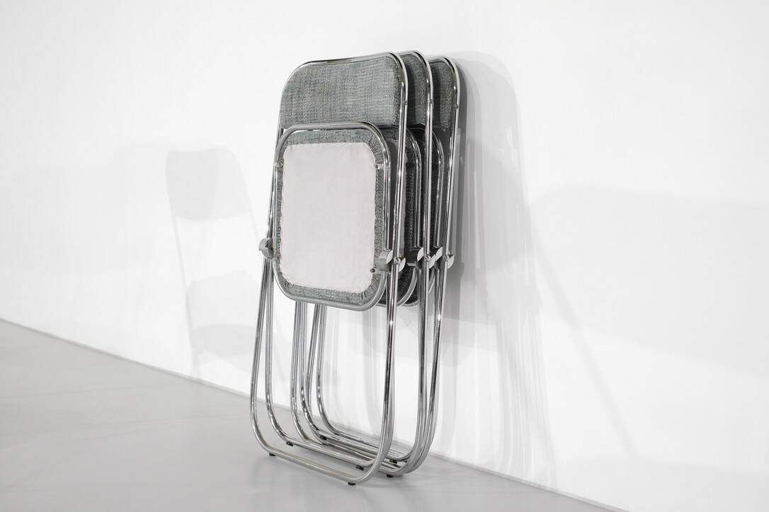 Set of 9 chrome folding chairs with fabric from the 1970s.