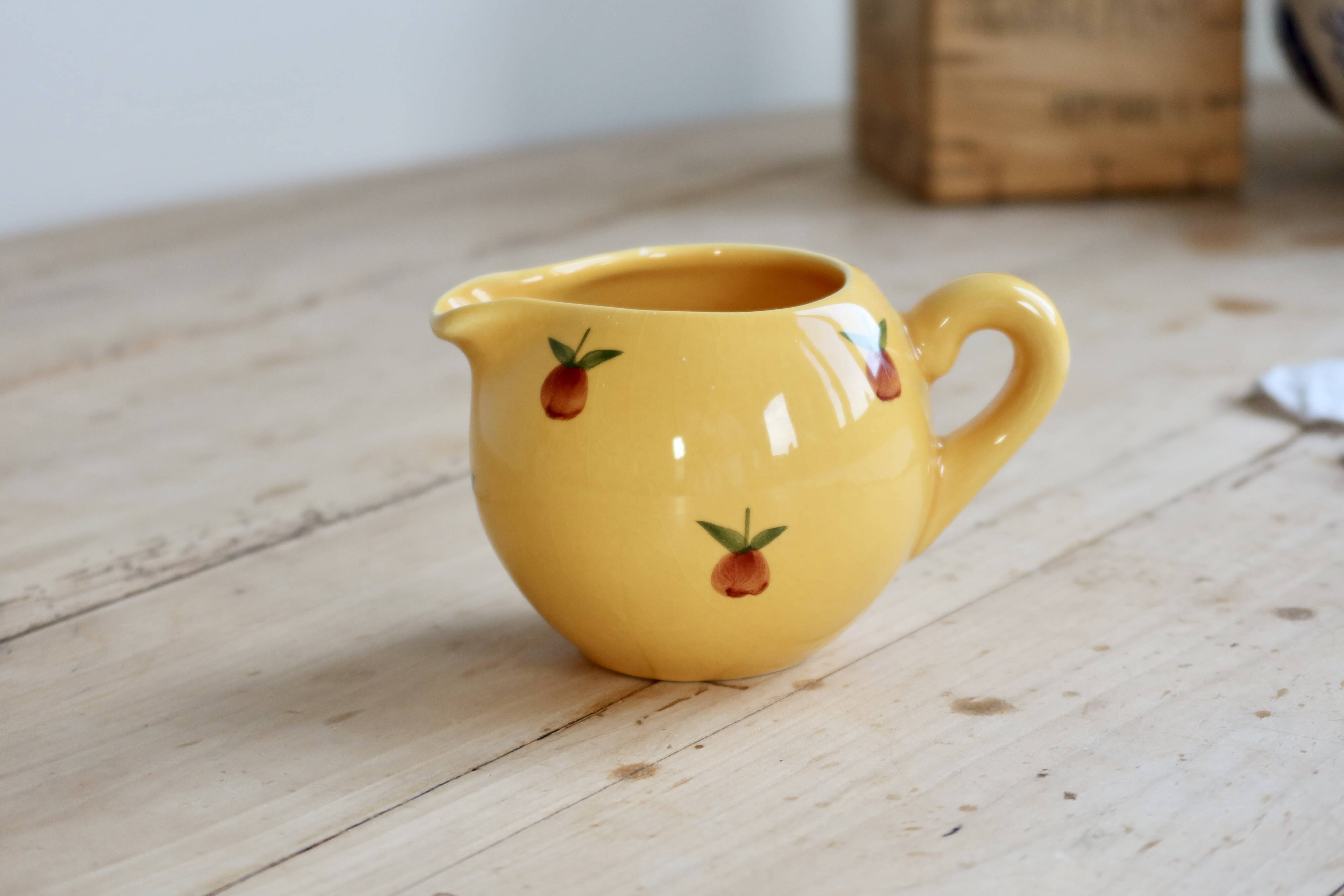 Vintage yellow ceramic milk jug