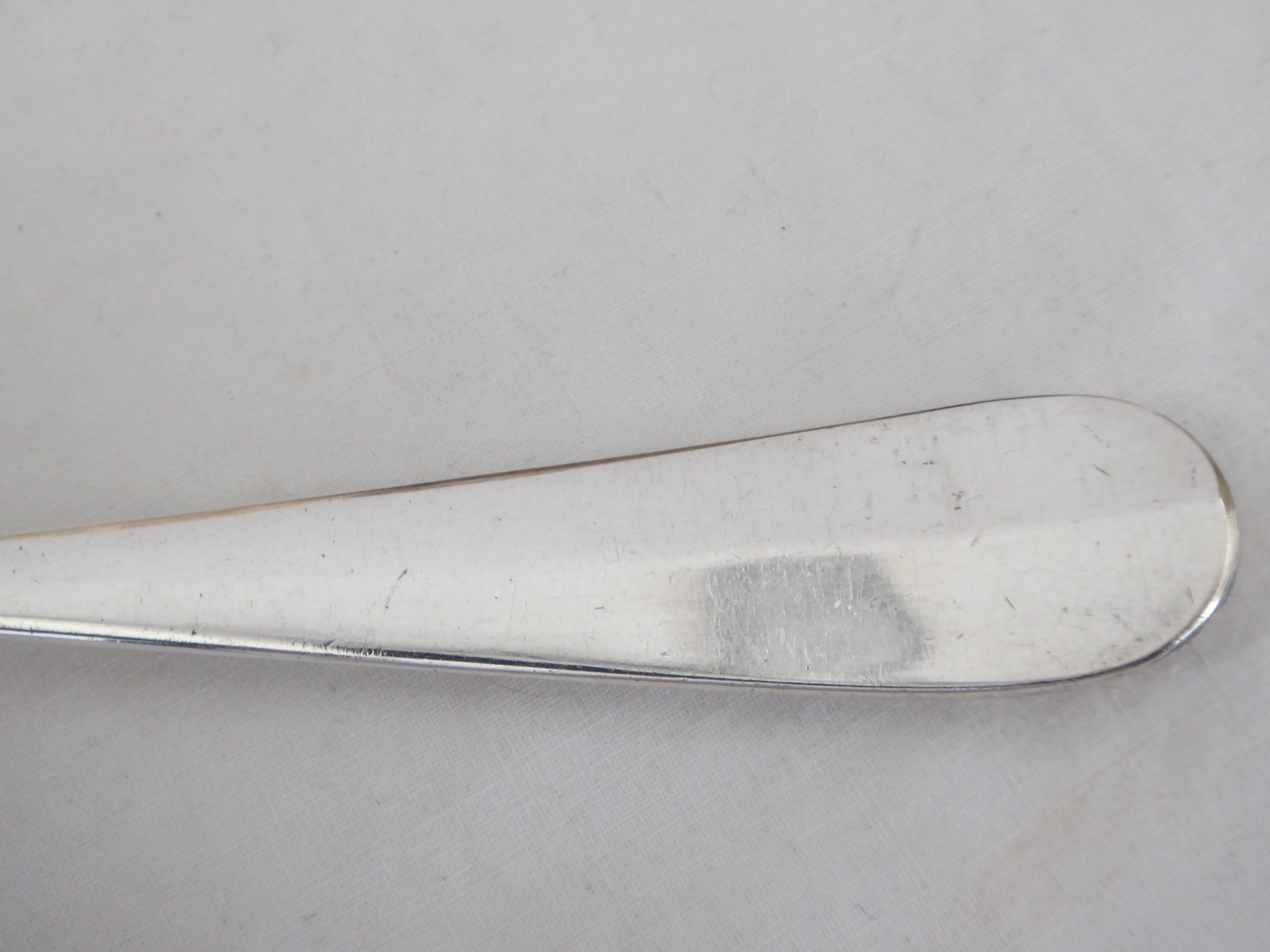 Silver metal sauce ladle