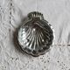 Vintage shell-shaped shiny silver-plated catchall.