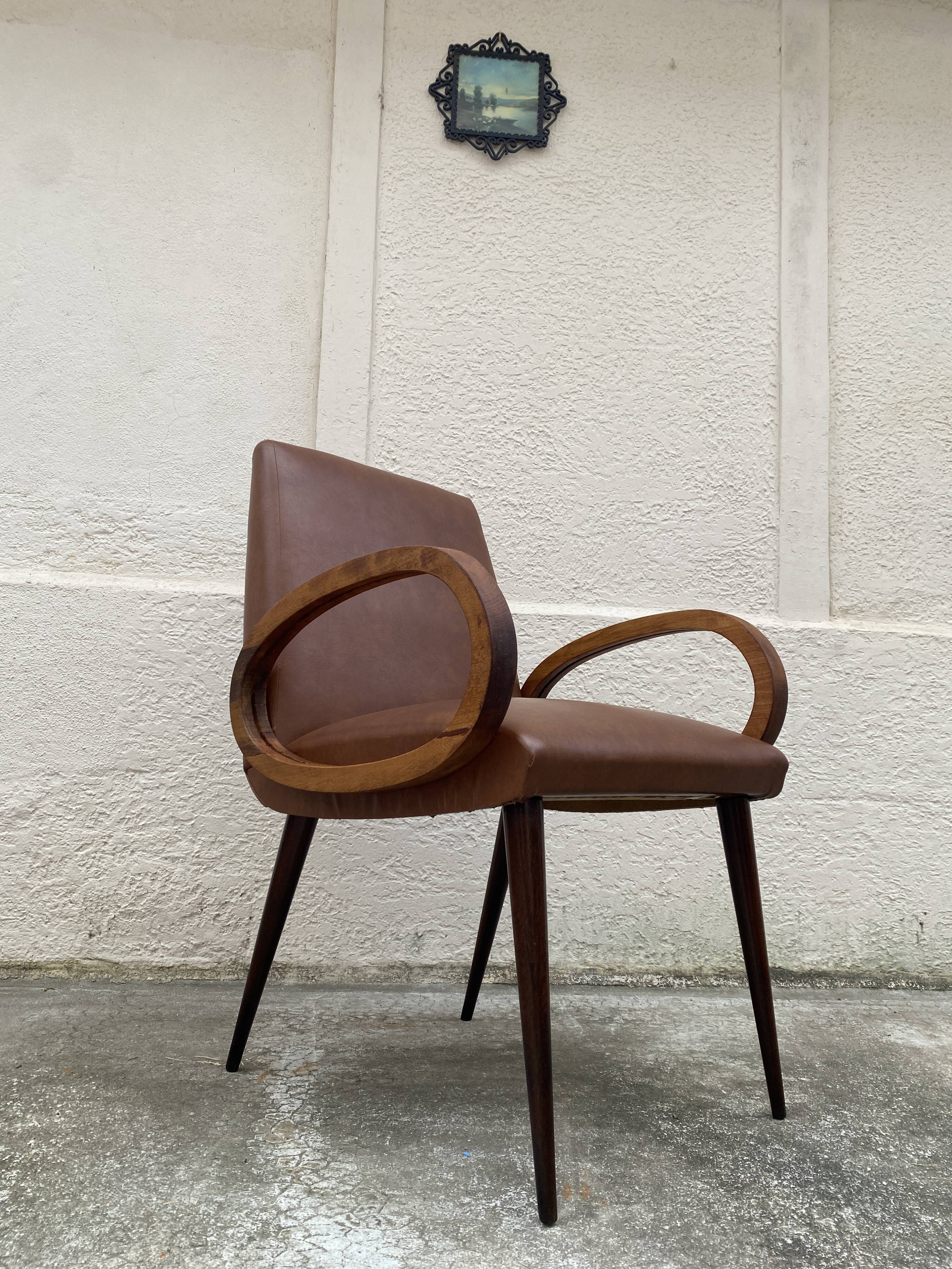 Mid-Century Scandinavian vintage retro armchair with oval armrests.