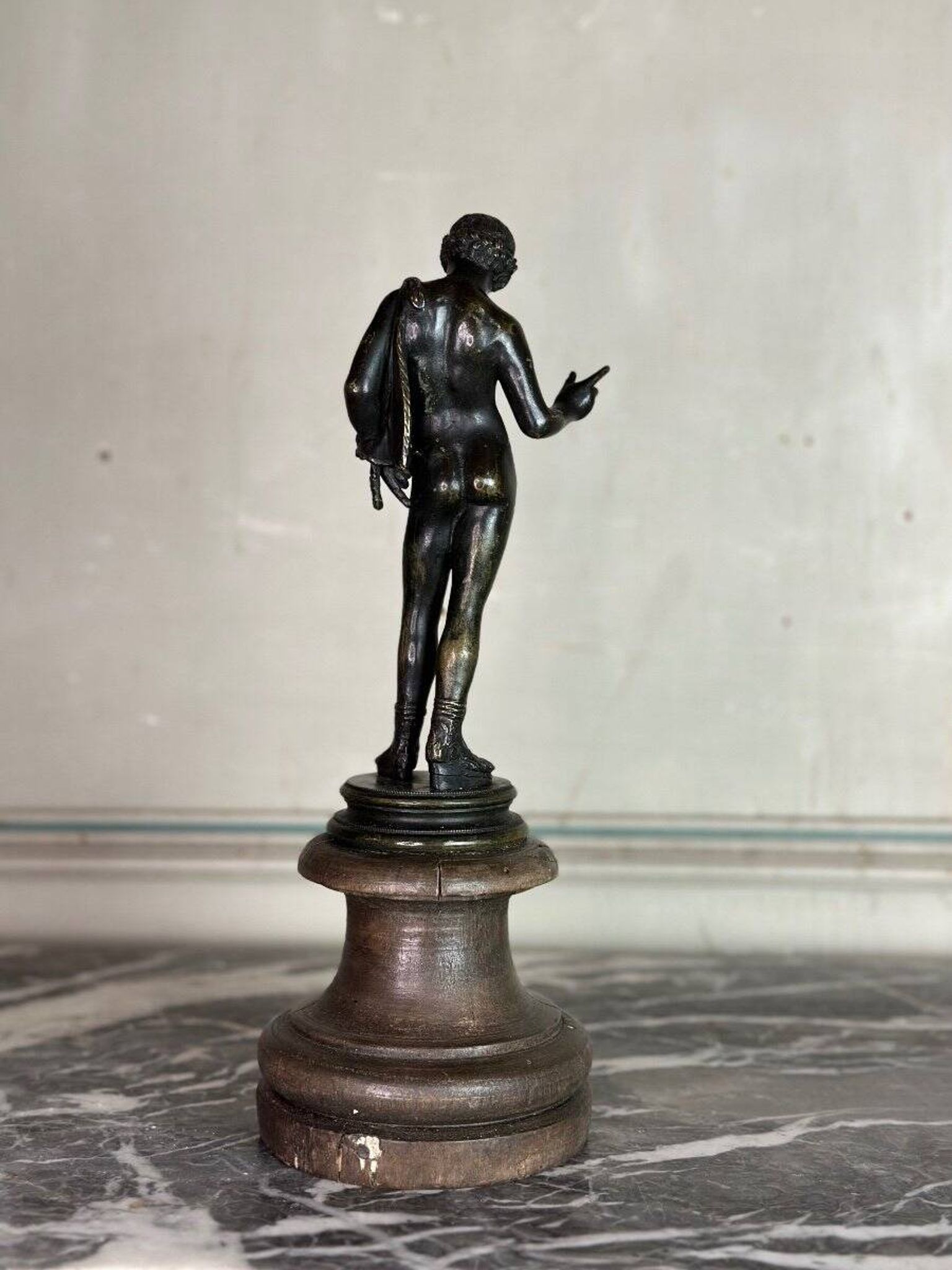 Narcissus, bronze after the antique on a wooden base, circa 1880.