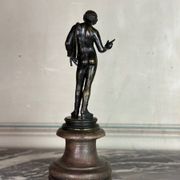 Narcissus, bronze after the antique on a wooden base, circa 1880.