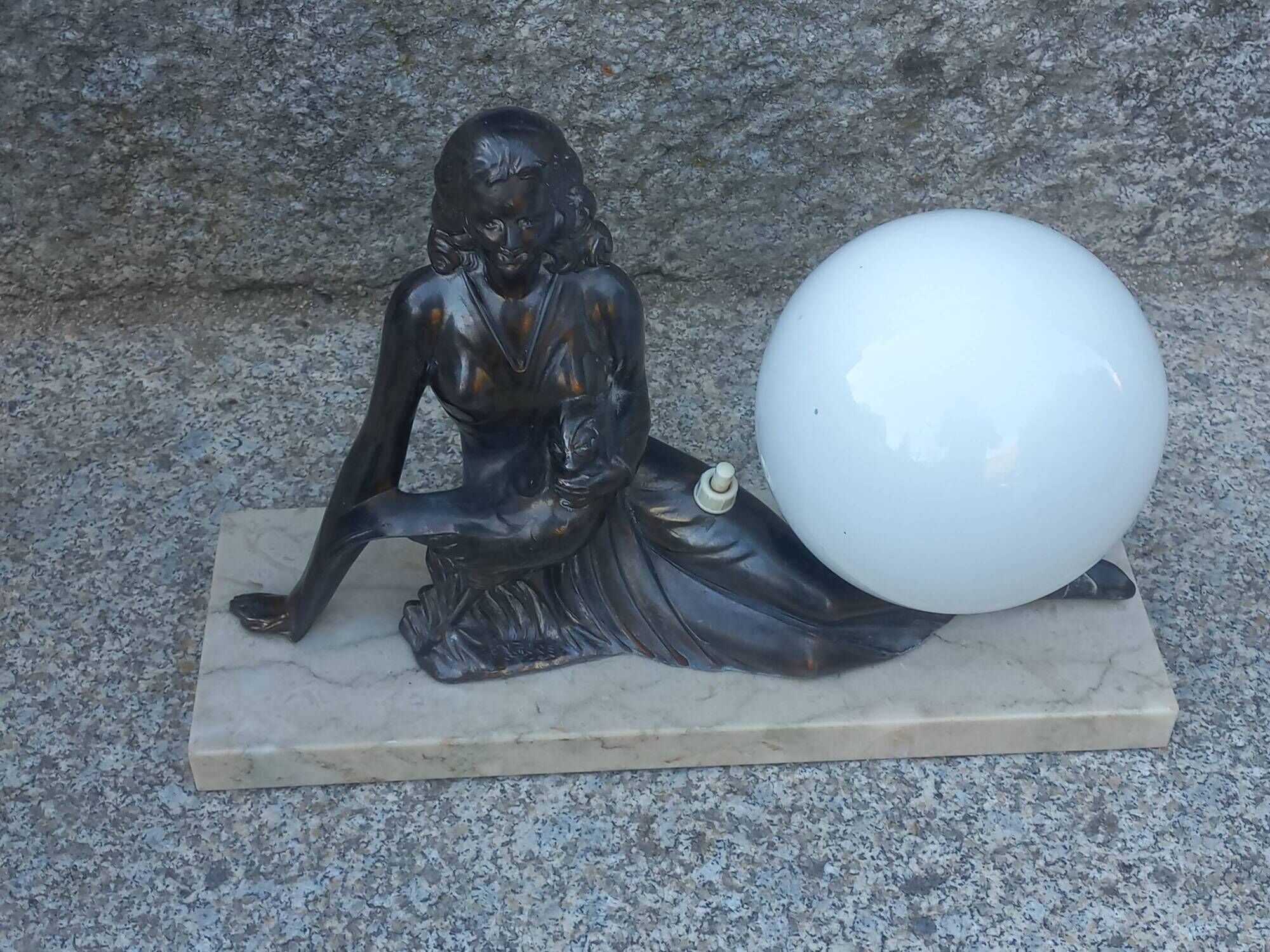 Art Deco lamp in cast iron and marble with a white opaline globe.