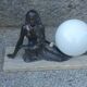 Art Deco lamp in cast iron and marble with a white opaline globe.