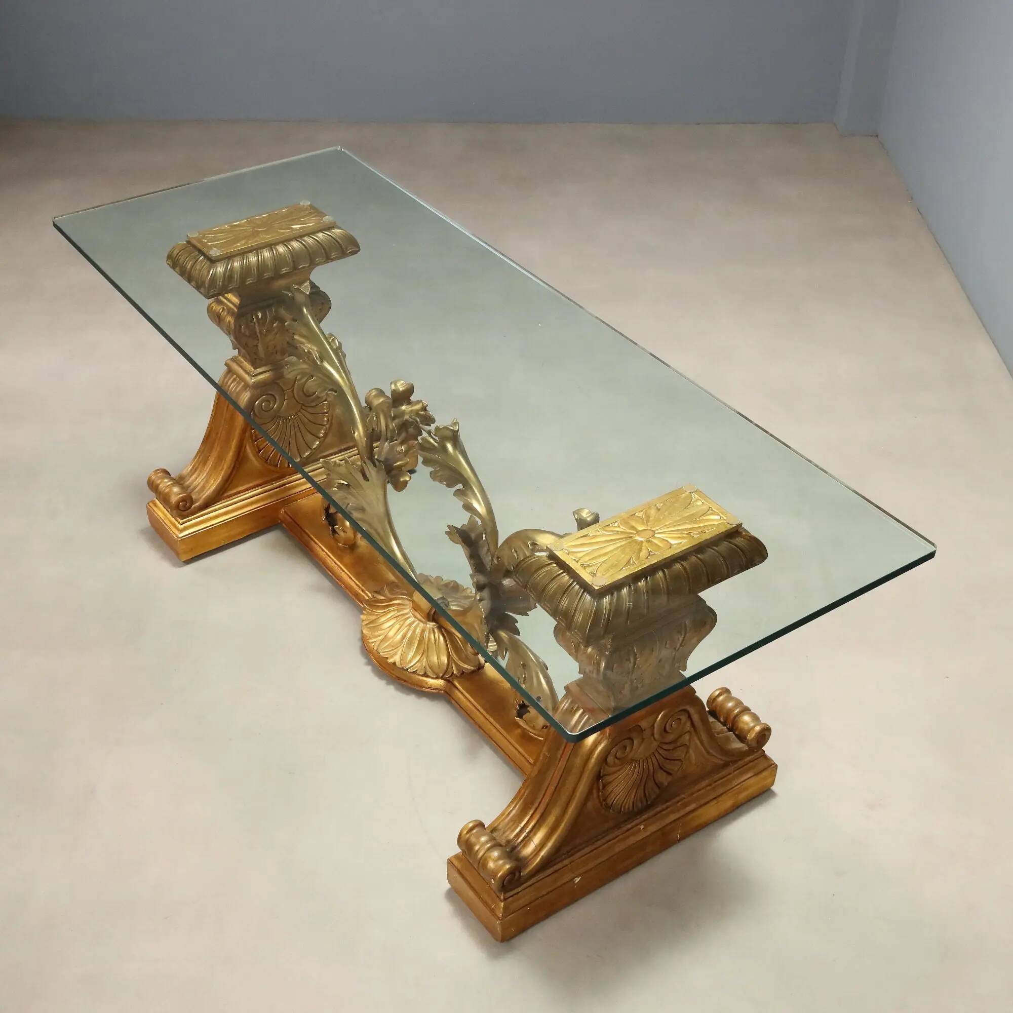 Antique coffee table in gilded wood with a glass top, Italy, 20th century.