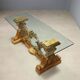 Antique coffee table in gilded wood with a glass top, Italy, 20th century.
