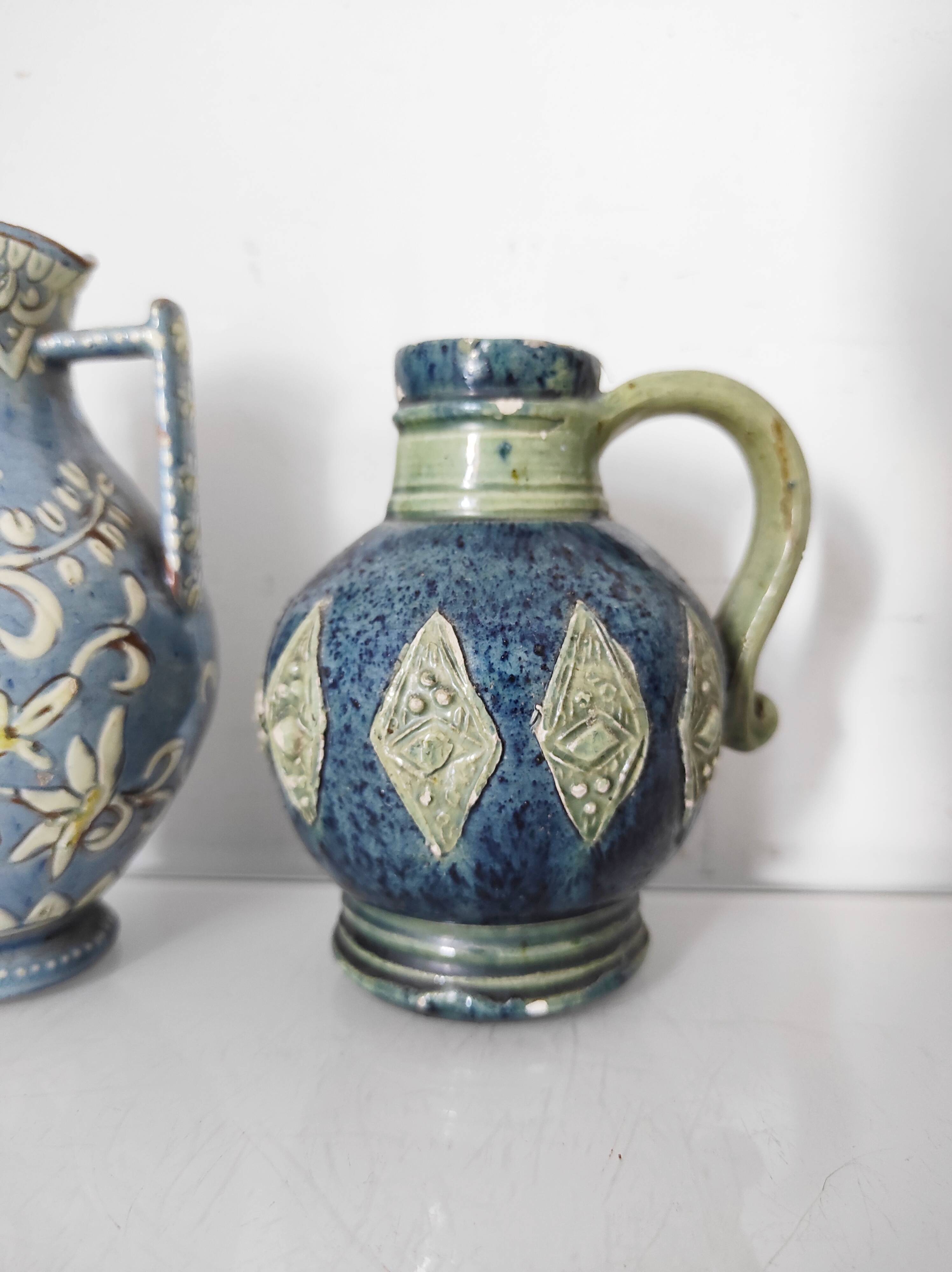 Two small blue ceramic vases