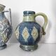 Two small blue ceramic vases