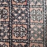 Vintage faded pink and black Berber rug