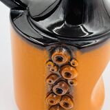 Modernist vase design, orange ceramic with relief cabochons from the 1970s.