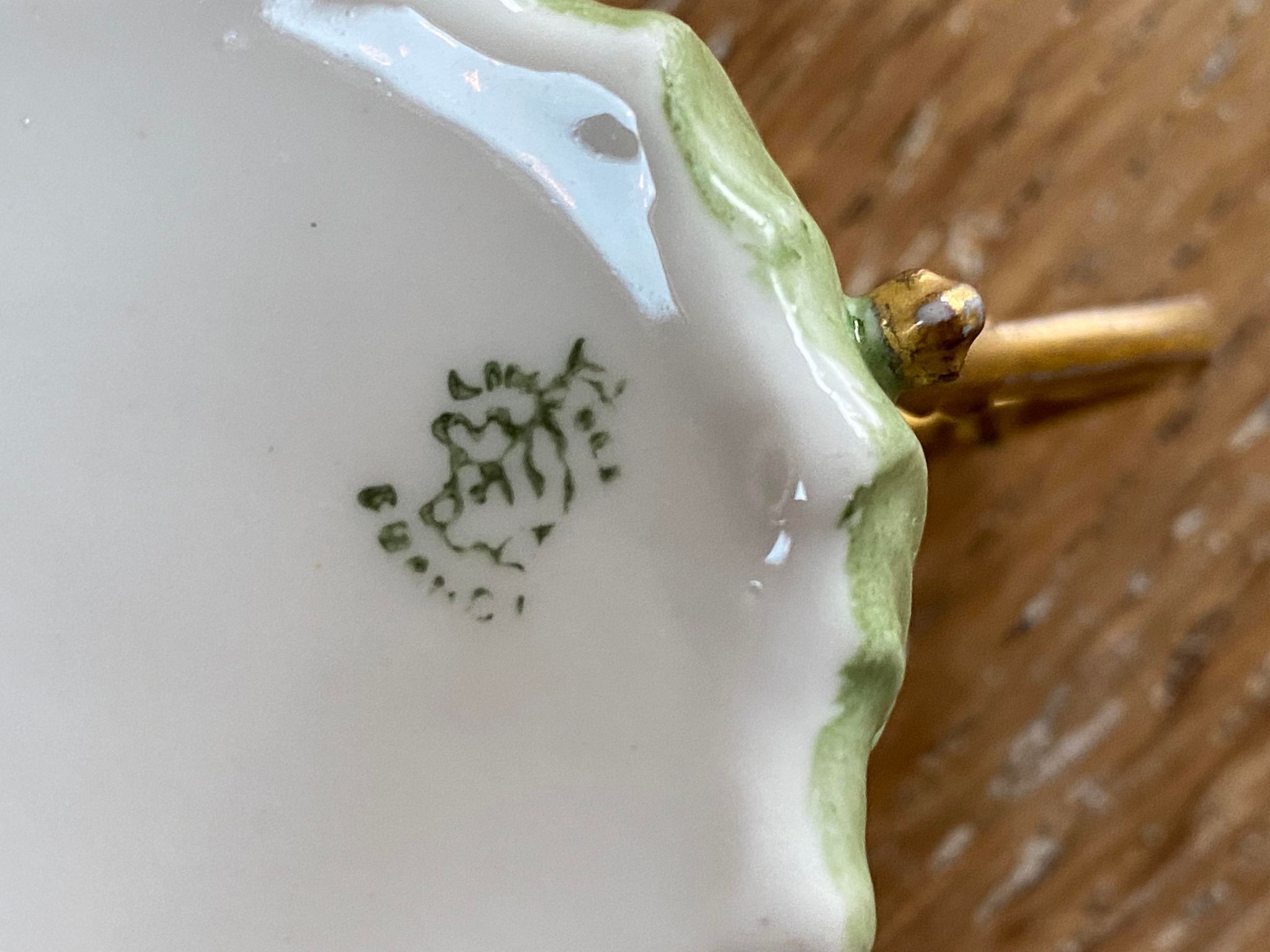 Extra fine porcelain cup pale green decorations and gilding