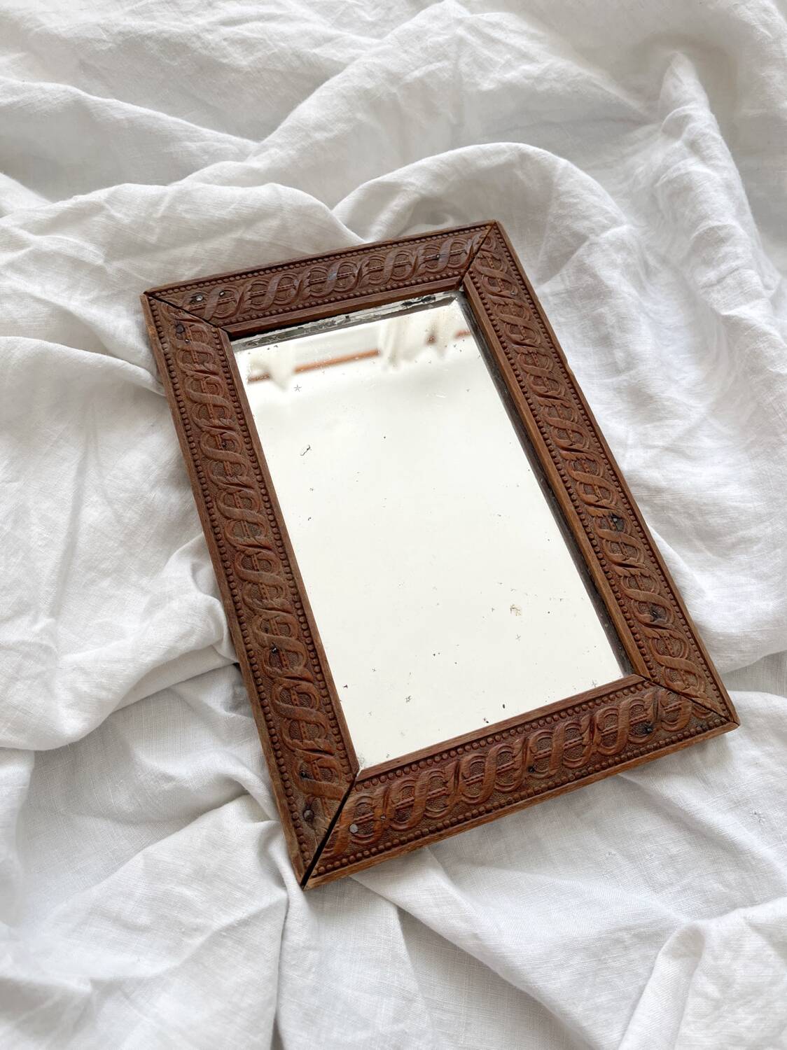 Antique mercury glass barber mirror and carved wooden frame