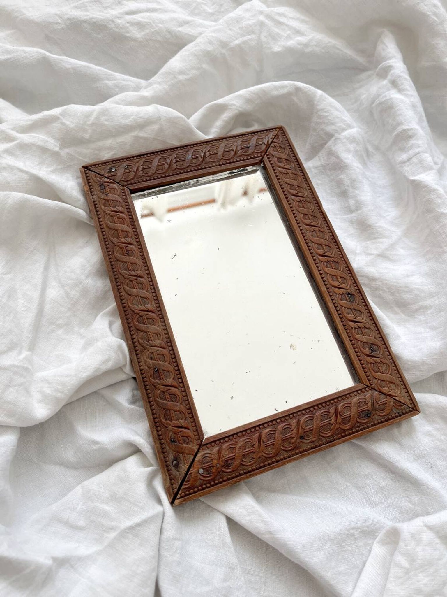 Antique mercury glass barber mirror and carved wooden frame