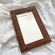 Antique mercury glass barber mirror and carved wooden frame