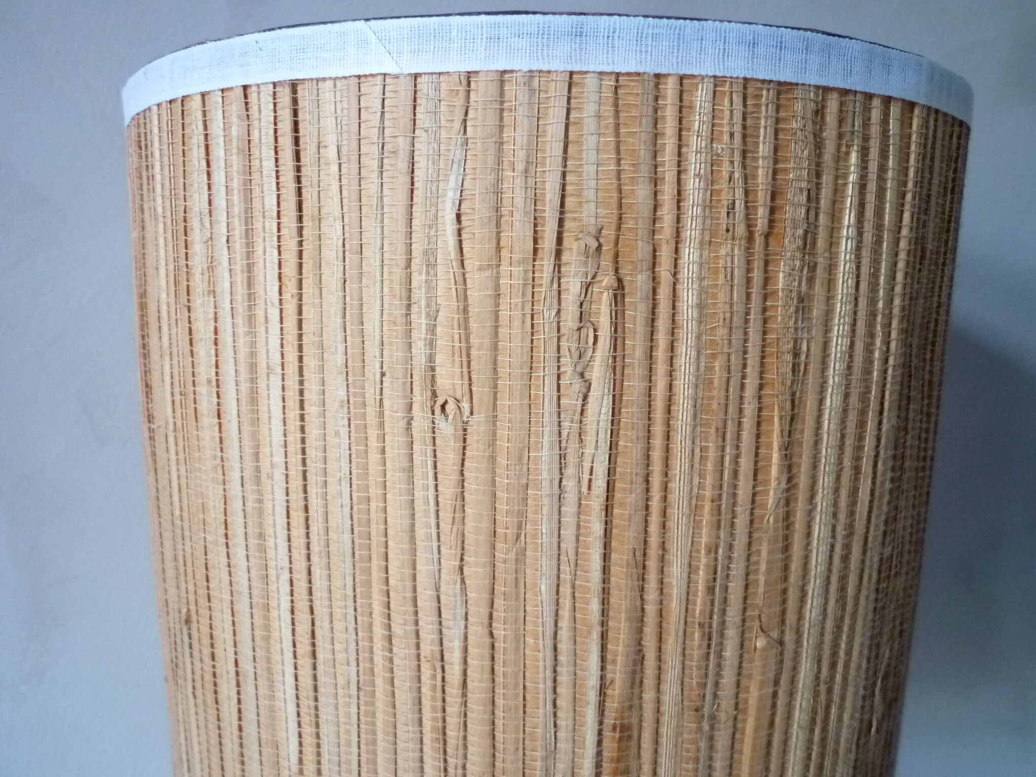 Lamp in glass and woven rattan