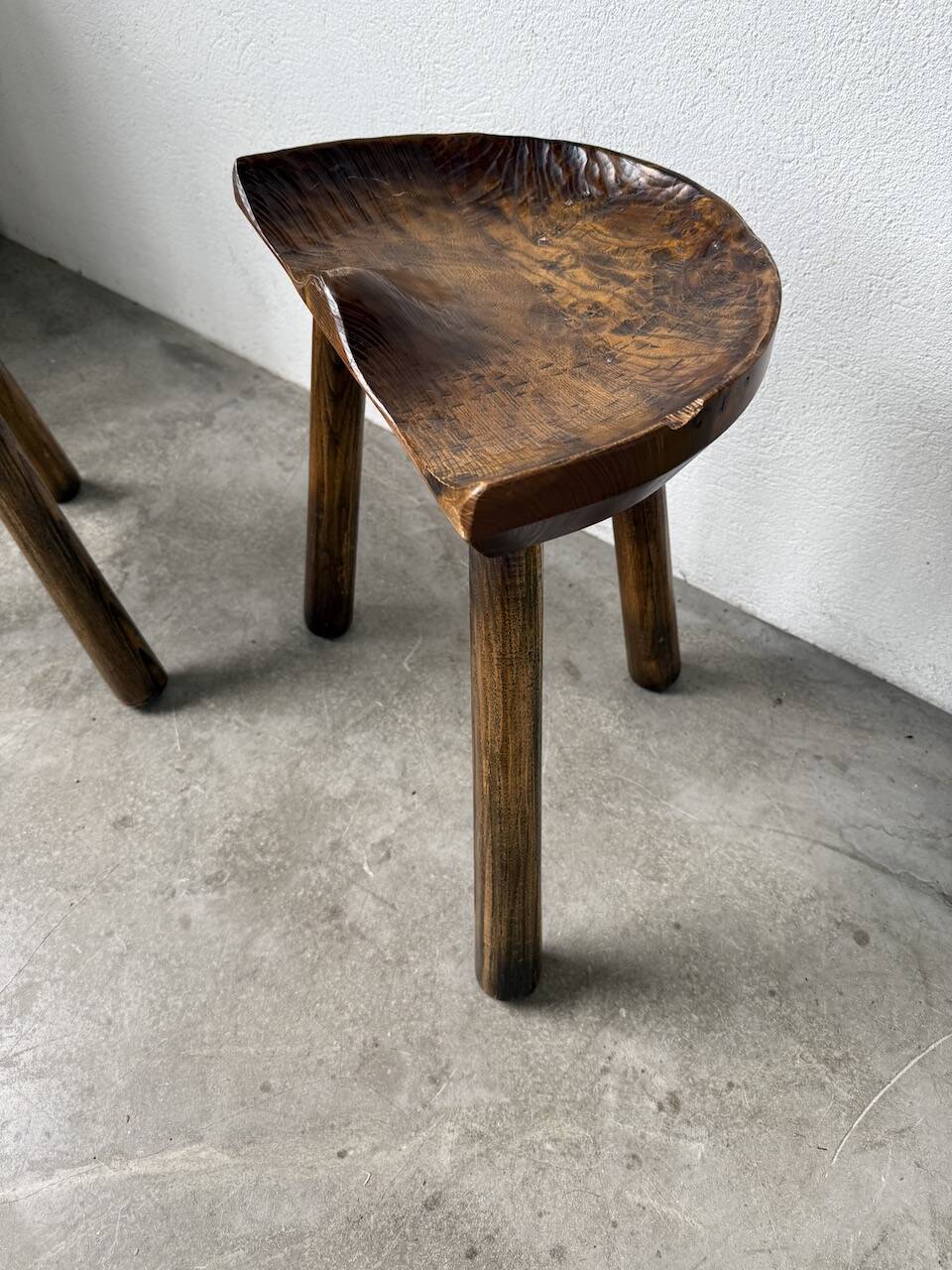 Pair of Le Selou tripod shepherd's stools